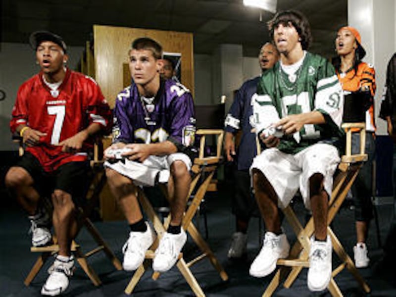 Gamers, from left, Charles James, Jet Steele, Steve Williams, center rear, Jesse Rhoades and Sheila Barger participate in in the taping of season three of ESPN's "Madden Nation" reality TV show. The newest version of the popular football video game, "Madd