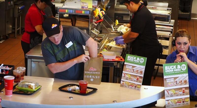 Stuart Edge performs a magic trick at Del Taco.