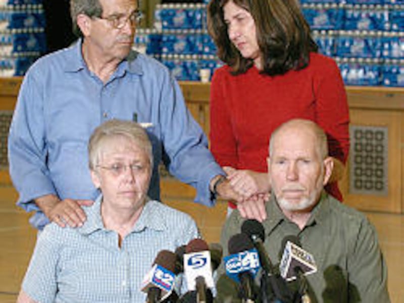 Thelma and Eraldo Soares, left, parents of Lori Hacking, and Doug and Janet Hacking, Mark Hacking's parents, comforted each other last July after Lori vanished. In April, Mark confessed to killing his wife, and his family retreated into the background.