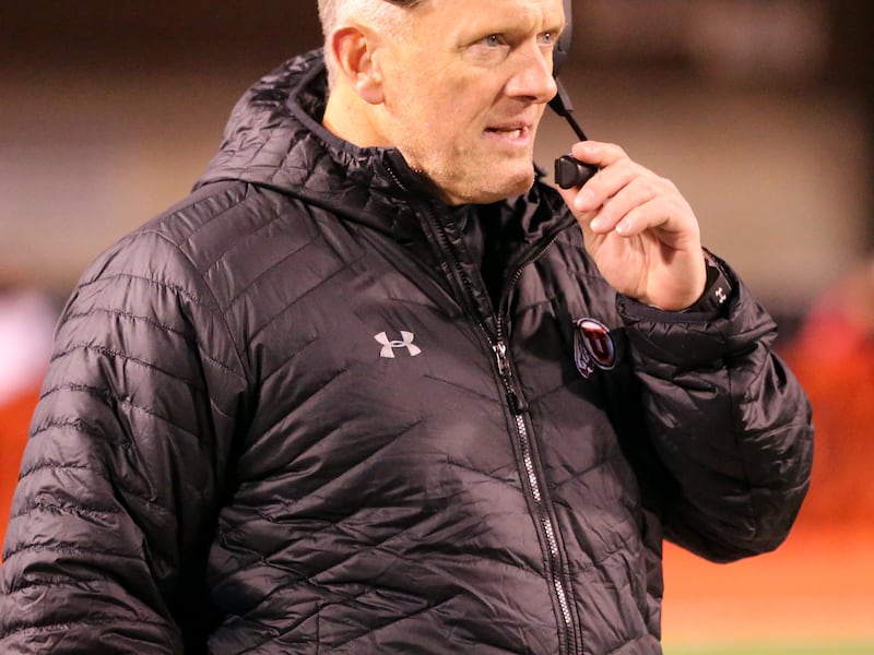 Utah Utes head coach Kyle Whittingham talks into his headset as BYU and Utah play at Rice Eccles Stadium in Salt Lake City on Saturday, Nov. 24, 2018. Utah won 35-27.