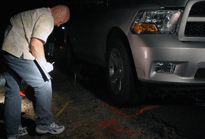 Vernal Police Sgt. Vance Norton diagrams the scene of a crash Sunday, Sept. 2, 2012. Investigators say a man was texting and driving when he struck a Vernal teen who was walking alongside 500 West with a friend. The teen suffered critical injuries. He die