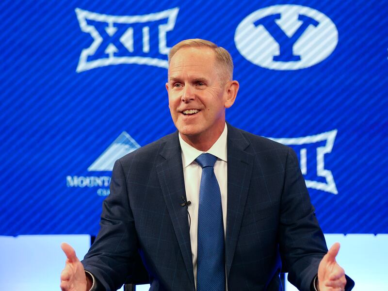 BYU athletic director Tom Holmoe speaks at a press conference announcing that BYU has accepted an invitation to the Big 12.