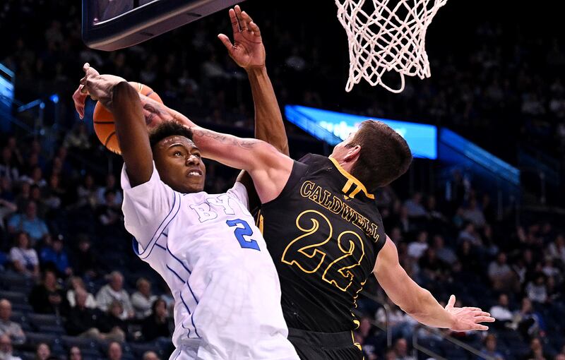 BYU Cougars guard Jaxson Robinson (2) is blocked by Southeastern Louisiana Lions guard Nick Caldwell (22) on Nov. 15, 2023.