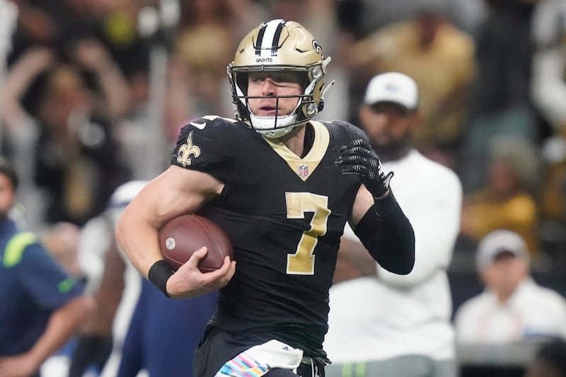 New Orleans Saints’ Taysom Hill carries the ball in an NFL football game against the Seattle Seahawks in New Orleans, Sunday, Oct. 9, 2022. (AP Photo/Gerald Herbert)
