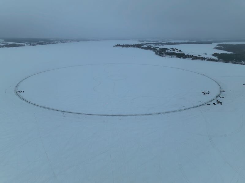 This photo provided by Aroostook UAS shows a giant ice disk that measures 1,776 feet – or 541 meters– is seen on the day it was set in motion, creating the world’s largest ice carousel, on Saturday, April 1, 2023, in Long Lake in Madawaska, Maine.