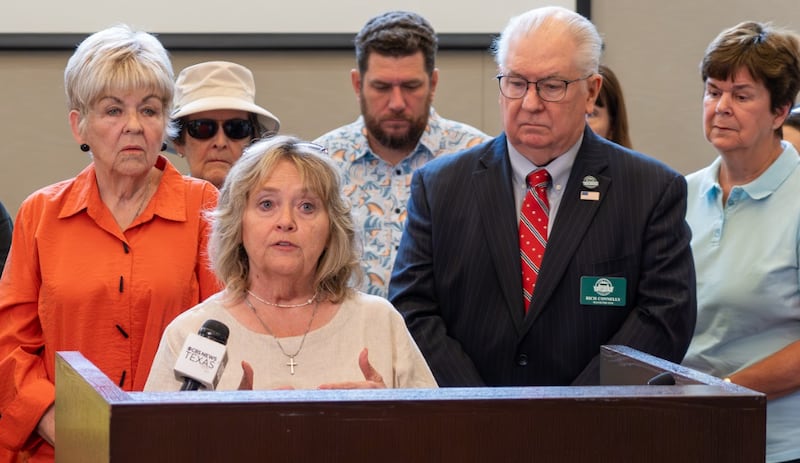 Sandra Ahlin speaks at a news conference about the height of the steeple of the planned Fairview Texas Temple.