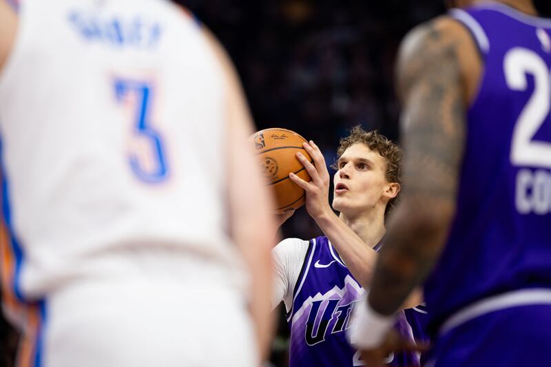 Utah Jazz forward Lauri Markkanen shoots a free throw during a game vs. Oklahoma City Thunder at the Delta Center.
