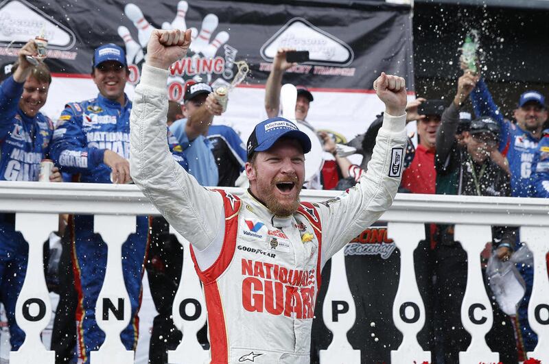 Dale Earnhardt Jr. celebrates in Victory Lane after winning the NASCAR Sprint Cup Series auto race at Pocono Raceway, Sunday, Aug. 3, 2014, in Long Pond, Pa.