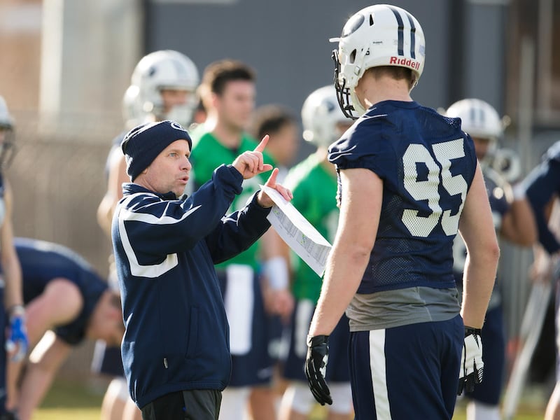 BYU tight ends coach Steve Clark works with players.