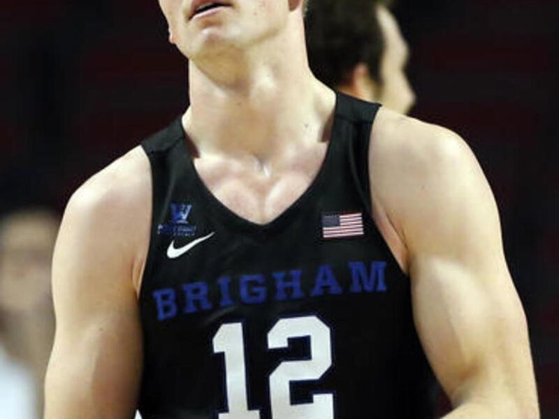 BYU forward Eric Mika reacts after a foul during the second half of an NCAA college basketball game against Illinois on Saturday, Dec. 17, 2016, in Chicago. Illinois won 75-73. (AP Photo/Nam Y. Huh)