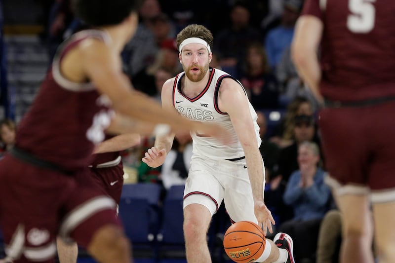 Gonzaga forward Drew Timme, center, controls the ball during game against Montana, Tuesday, Dec. 20, 2022, in Spokane, Wash.