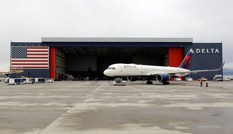 A Delta plane taxis to the Delta hangar at the Salt Lake City International Airport in Salt Lake City on Wednesday, April 15, 2020.