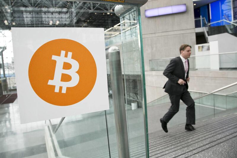 A person arrives for the Inside Bitcoins conference and trade show, Monday, April 7, 2014 in New York. Bitcoin users exchange cash for digital money using online exchanges, then store it in a computer program that serves as a wallet. The program can trans