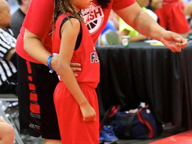 Natalie Williams coaches daughter Ayla, 8, in a basketball game this summer. Williams, 44, will be inducted into the Women's Basketball Hall of Fame in June 2016,
