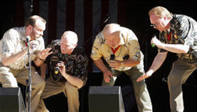 Scott Delude, left, Allen Gasper, Brian Beck and Bobby Gary Jr. perform Monday at the Gallivan Center.