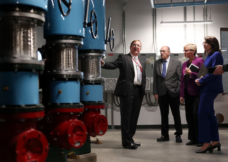Energy Secretary Jennifer M. Granholm tours the pump room of Gardner Commons at the University of Utah.
