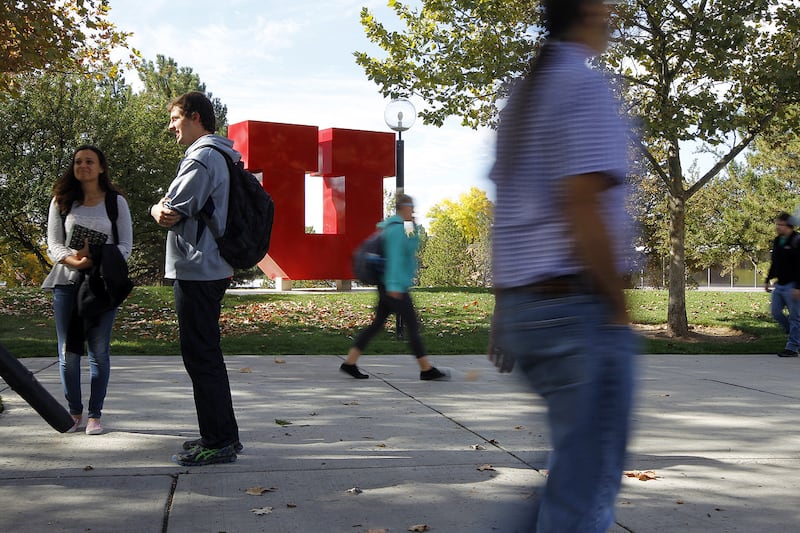 FILE - Students walk past the "block U" on the University of Utah's campus in Salt Lake City, Tuesday, Oct. 20, 2015.