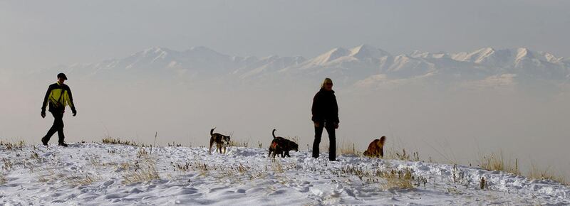 People walk along the shoreline trail in Salt Lake City on Friday, Dec. 30, 2016.