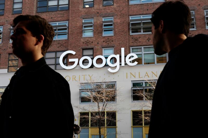 In this Dec. 4, 2017 file photo, people walk by Google offices in New York. Google is still having trouble protecting the personal information on its Plus service, prodding the company to accelerate its plans to shut down a little-used social network crea