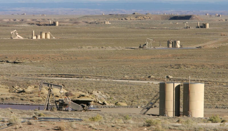 Newfield Exploration oil storage tanks line the landscape near Myton, Utah. The Texas-based energy company laid off 200 of its 1,300 employees Wednesday, including 80 employees in Utah, citing low oil prices.