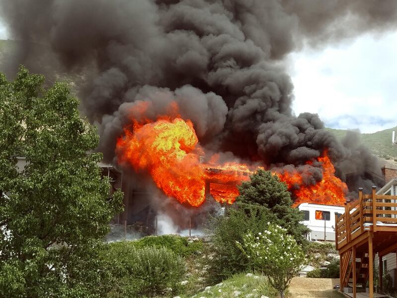 A house in Centerville becomes fully engulfed in flames.
