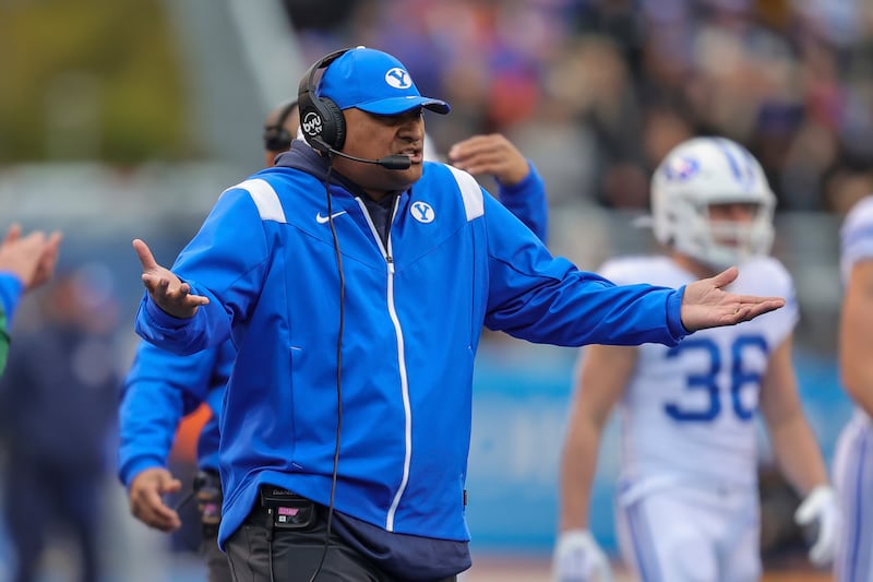 BYU coach Kalani Sitake talks with his players after a Boise State touchdown Saturday, Nov. 5, 2022, in Boise, Idaho.