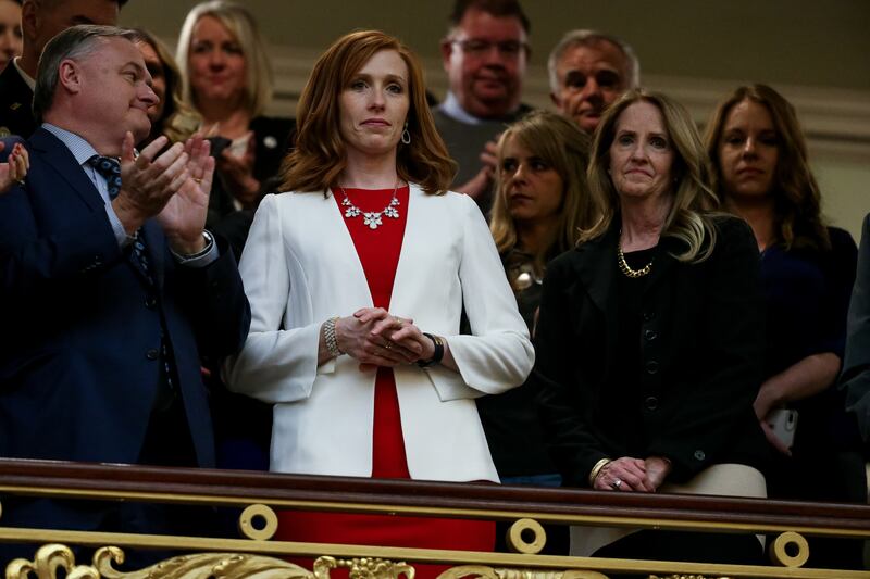 Jennie Taylor, wife of slain Utah National Guard Maj. Brent Taylor, center, and Tammy Taylor, Maj. Taylor's mother, stand as the House chamber audience rises to honor the families of Utahns who fell in the line of duty in the last year during Gov. Gary He