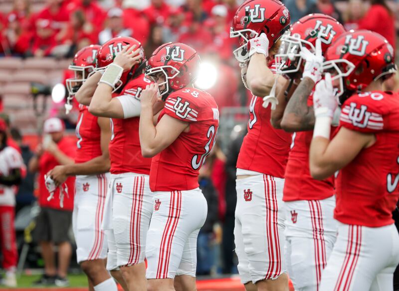 Utah Utes players put on their helmets before they play the Penn Sate Nittany Lions in the 109th Rose Bowl in Pasadena on Monday, Jan. 2, 2023.
