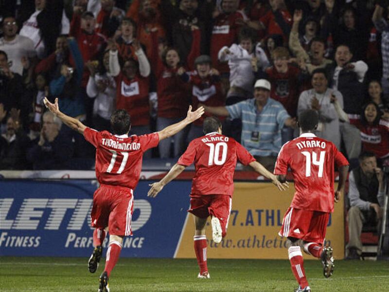 Chicago's John Thorrington (11), Cuauhtemoc Blanco (10) and Patrick Nyarko (14) celebrate Blanco's goal Saturday.