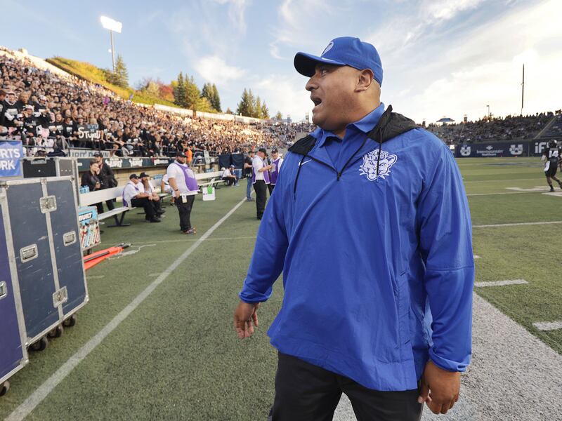 Brigham Young Cougars head coach Kalani Sitake talks with Aggie fans in Logan on Friday, Oct. 1, 2021.