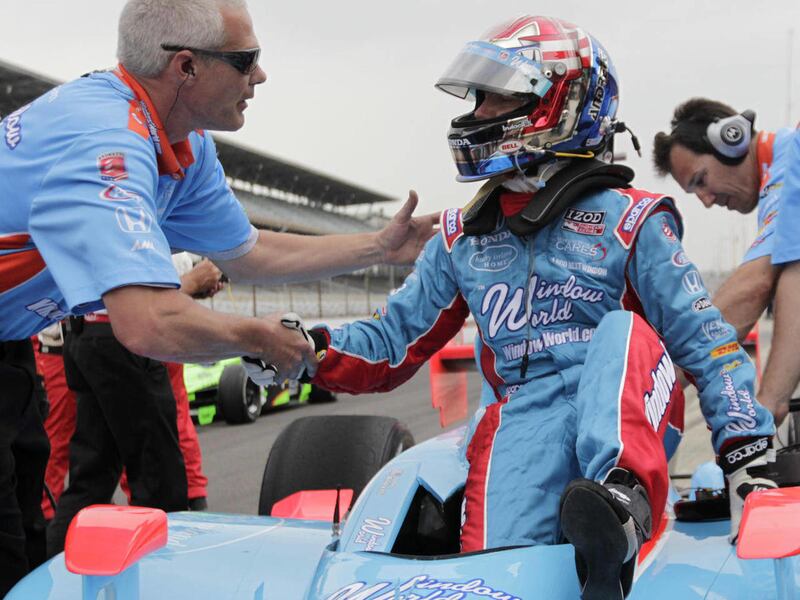 John Andretti, right, is congratulated by a member of his crew after he qualified on the opening day of time trials for the Indianapolis 500 auto race at Indianapolis Motor Speedway in Indianapolis, Saturday, May 21, 2011. Andretti was the only driver of