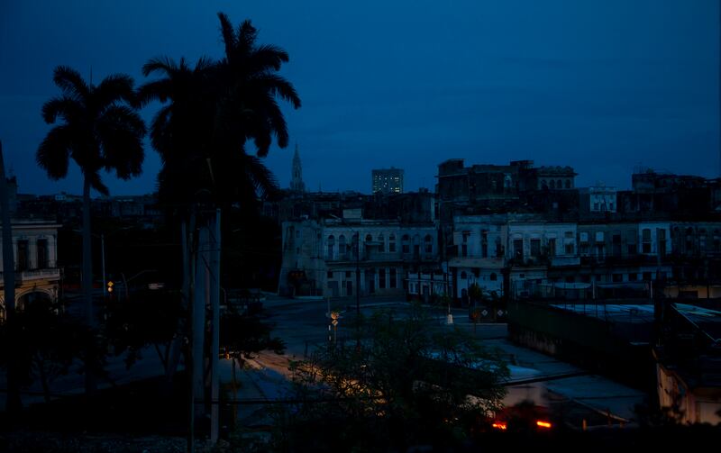A neighborhood sits dark during a blackout triggered by the passing of Hurricane Ian in Havana, Cuba.
