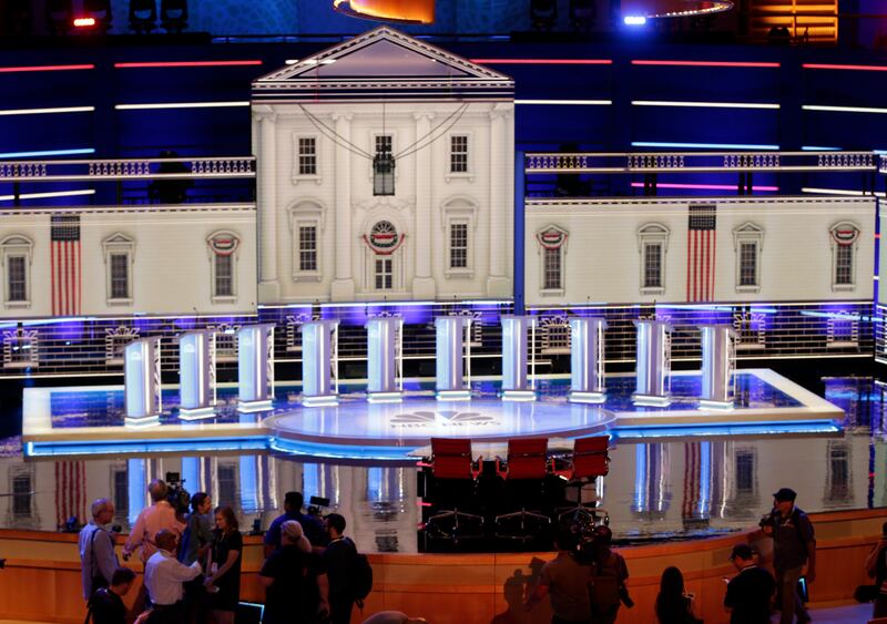 Members of the media gather for a walk-through of the stage set-up for the first democratic debate, Wednesday, June 26, 2019.