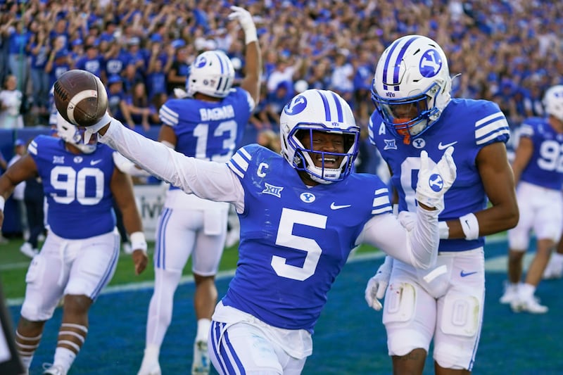 BYU cornerback Eddie Heckard (5) celebrates his fumble recovery touchdown against Texas Tech, Oct. 21, 2023, in Provo, Utah.