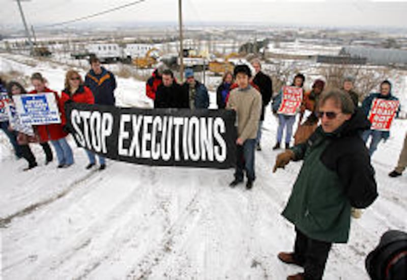 Rick Halperin, chairman of Amnesty International's board of directors, speaks during an anti-death-penalty vigil outside the Utah State Prison Saturday.