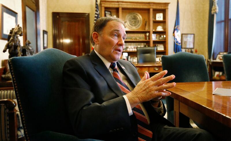 FILE - Utah Gov. Gary Herbert speaks during an interview at the Utah state Capitol, Thursday, March 8, 2018, in Salt Lake City. So-called free-range parenting will soon be the law of the land in Utah after the governor signed what appears to be the countr