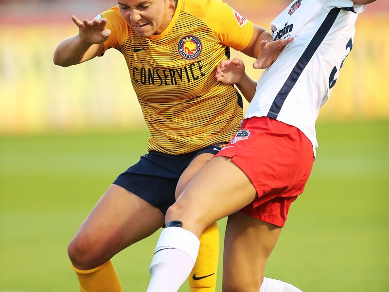 Utah Royals FC defender Rachel Corsie (2) battles Washington Spirit forward Ashley Hatch (33) for the ball as the Utah Royals and Washington Spirit play at Rio Tinto Stadium in Sandy on Wednesday, Aug. 8, 2018.