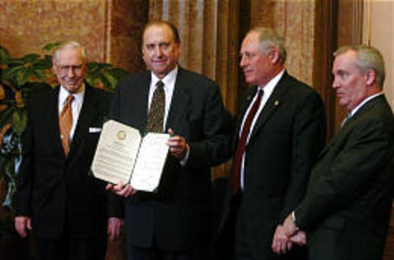 President James E. Faust, left, and President Thomas S. Monson receive statement from Lt. Gov. Patrick Quinn and Rep. Daniel J. Burke.