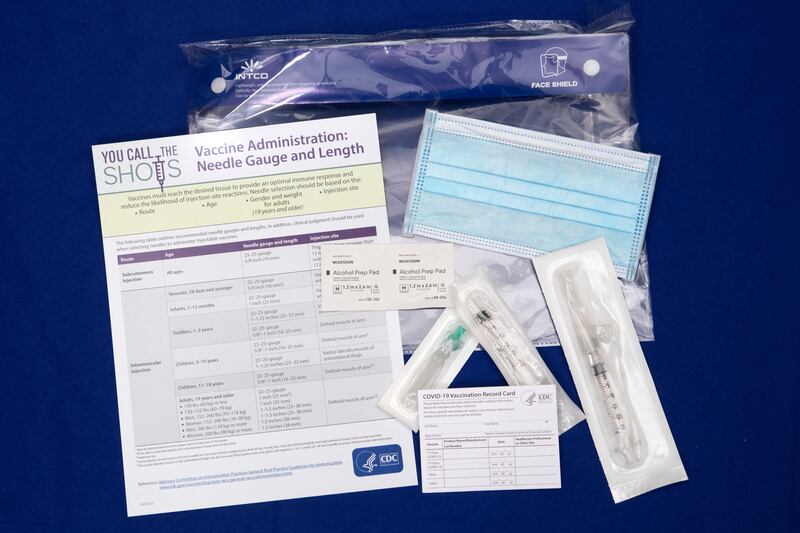 A display shows items that will be provided with COVID-19 vaccines at Operation Warp Speed headquarters in Washington, D.C. Nov. 13, 2020. Operation Warp Speed is an effort by several U.S. government components and public partnerships to facilitate the development, manufacturing and distribution of COVID-19 vaccines, therapeutics and diagnostics.