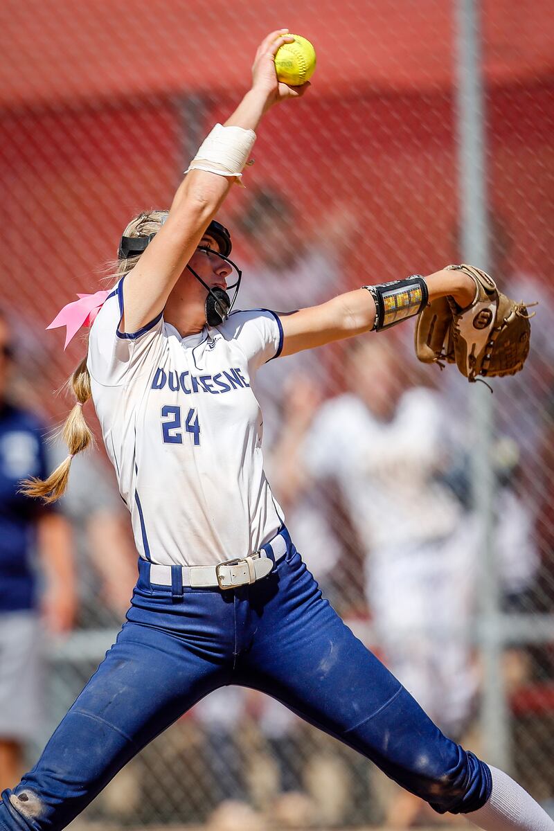 Duchesne pitcher Kelsey Grant, wearing white, delivers a pitch