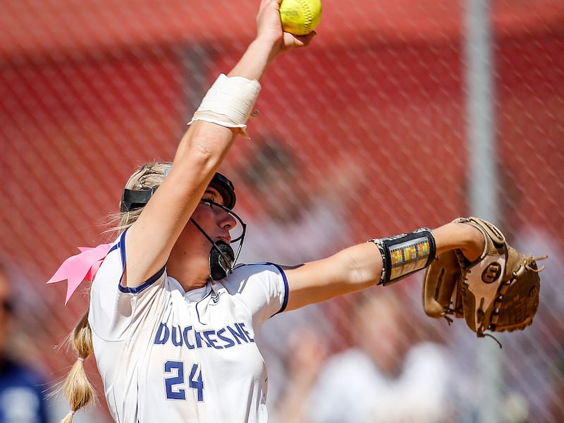 Duchesne pitcher Kelsey Grant, wearing white, delivers a pitch