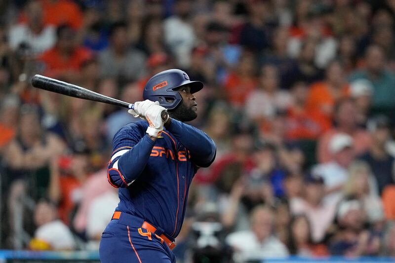 Houston Astros’ Yordan Alvarez hits a sacrifice fly to score Jose Altuve during the third inning.