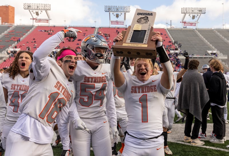 The Skyridge Falcons celebrate after beating the Canyon Chargers in the 6A state football championship at Rice-Eccles Stadium at the University of Utah in Salt Lake City on Friday, Nov. 18, 2022. The Falcons won 17-7.