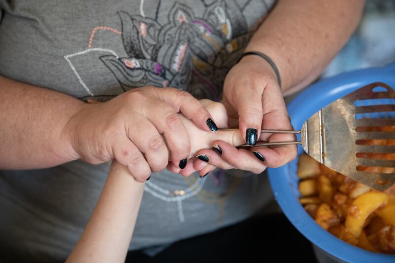 Kira Volar cares for her sister Tara, Saturday, August 4, 2018, in their home outside Sacramento, Calif. Kira is a 47-year-old full-time caregiver to her sister, who is paralyzed and has an intellectual disability. Kira has made caregiving her life's miss