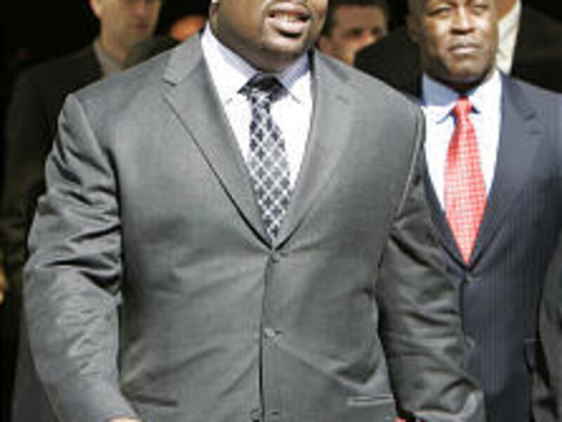 Chicago Bears defensive lineman Terry 'Tank' Johnson, here entering Cook County Court in March, has been released by the team after repeated legal stumbles.