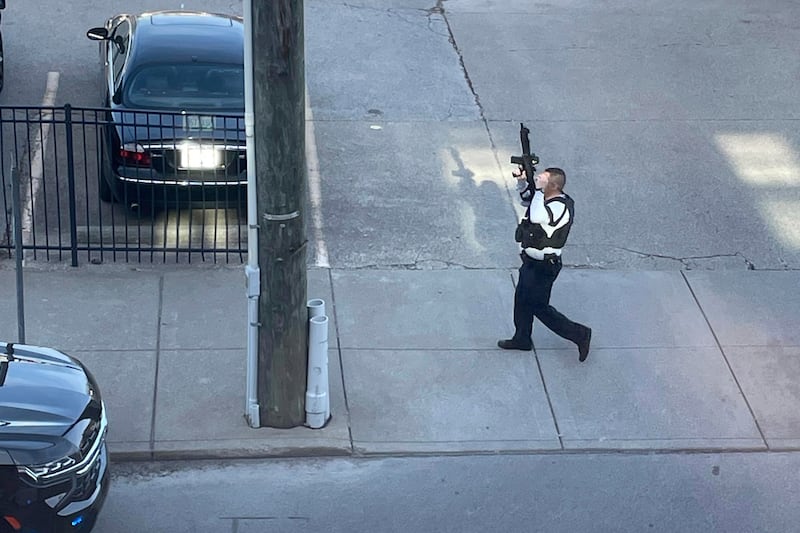 Police presence near the scene of a shooting in Louisville, Ky.