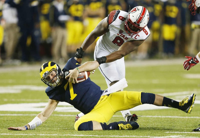 Utah Utes defensive end Nate Orchard (8) sacks Michigan Wolverines quarterback Shane Morris (7) in Ann Arbor, Michigan Saturday, Sept. 20, 2014. Utah beat Michigan 26-10 after a 2 hour 24 minute lightning delay.