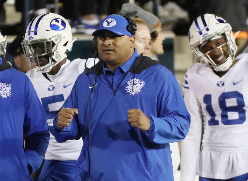 Brigham Young Cougars coach Kalani Sitake celebrates a field goal in a game against the Utah State Aggies.