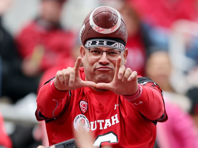 A fan flashes the “U” during the 22 Forever Game at Rice-Eccles Stadium in Salt Lake City on Saturday, April 22, 2023.