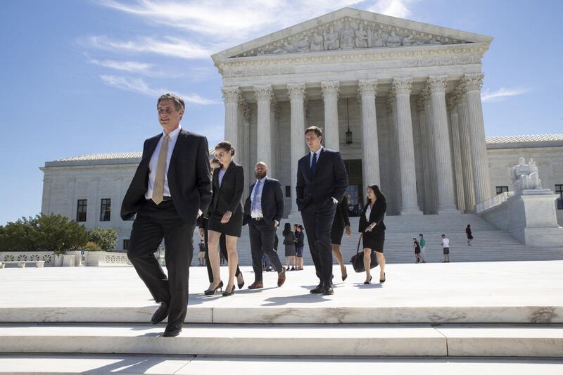 People leave the Supreme Court in Washington, Monday, June 26, 2017, as justices issued their final rulings for the term. The high court is letting a limited version of the Trump administration ban on travel from six mostly Muslim countries to take effect